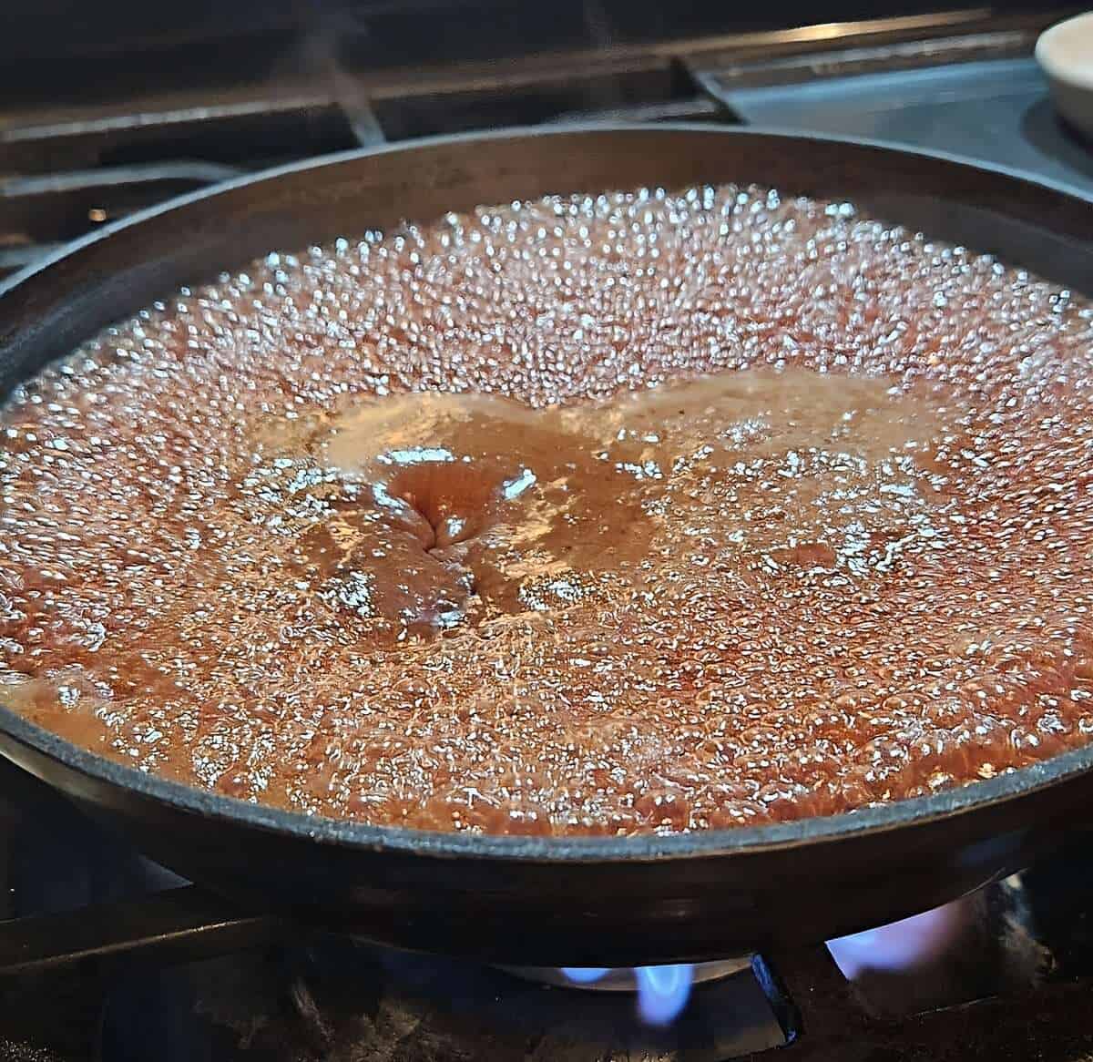 currant glaze boiling in a pot on stove