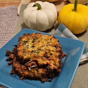 finished zucchini fritters on a plate