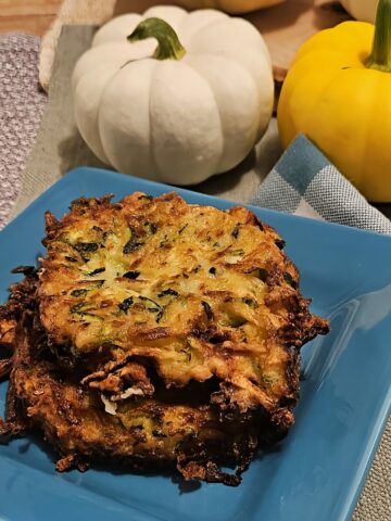 finished zucchini fritters on a plate
