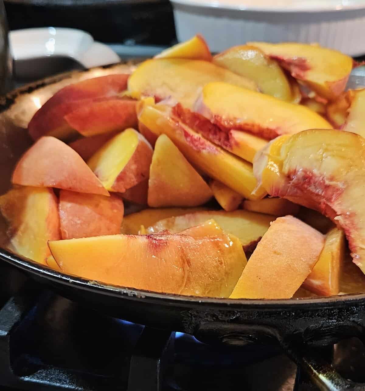 raw peaches in sauté pan