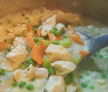 chicken cobbler base being thickened and stirred