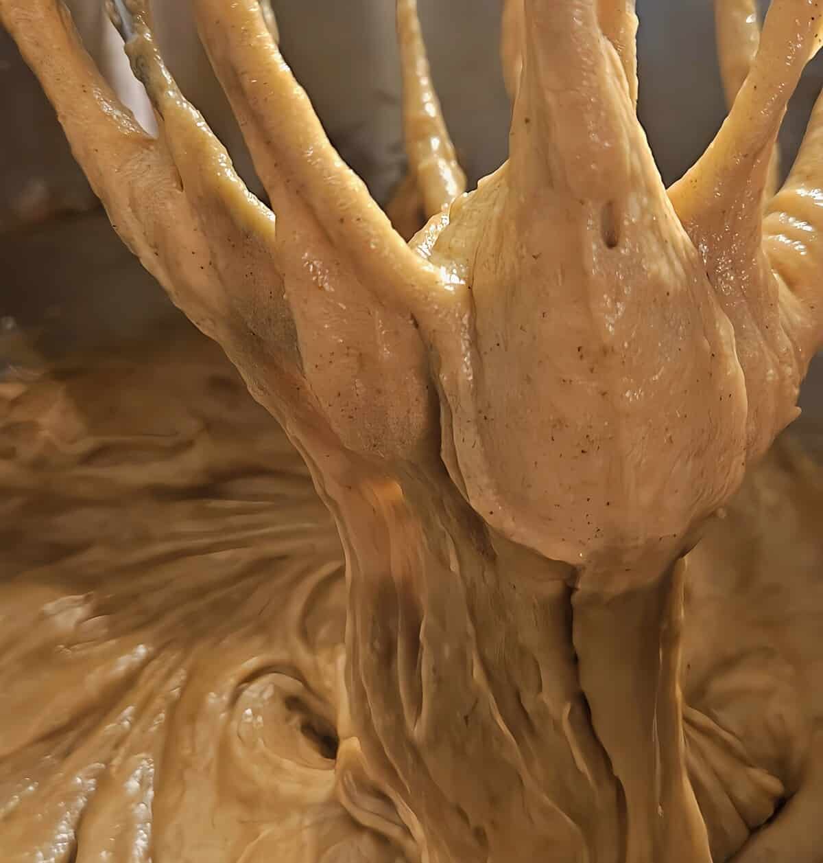 fully combined whoopie pie batter in the mixer, whip lifted to show consistency