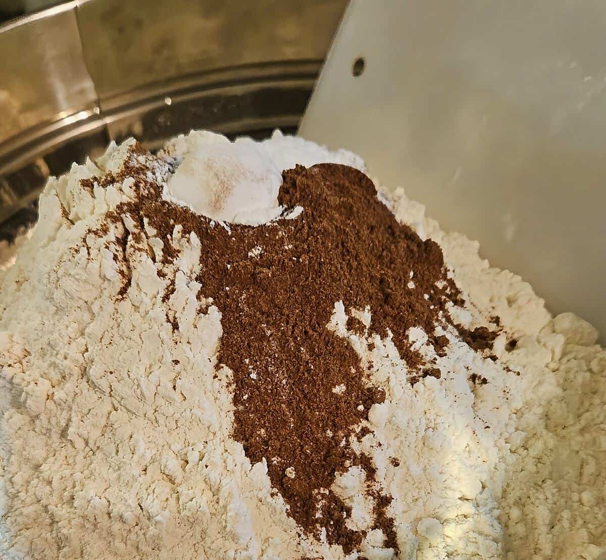 whoopie pie dry batter ingredients in a drum seive prepared to be sifted together