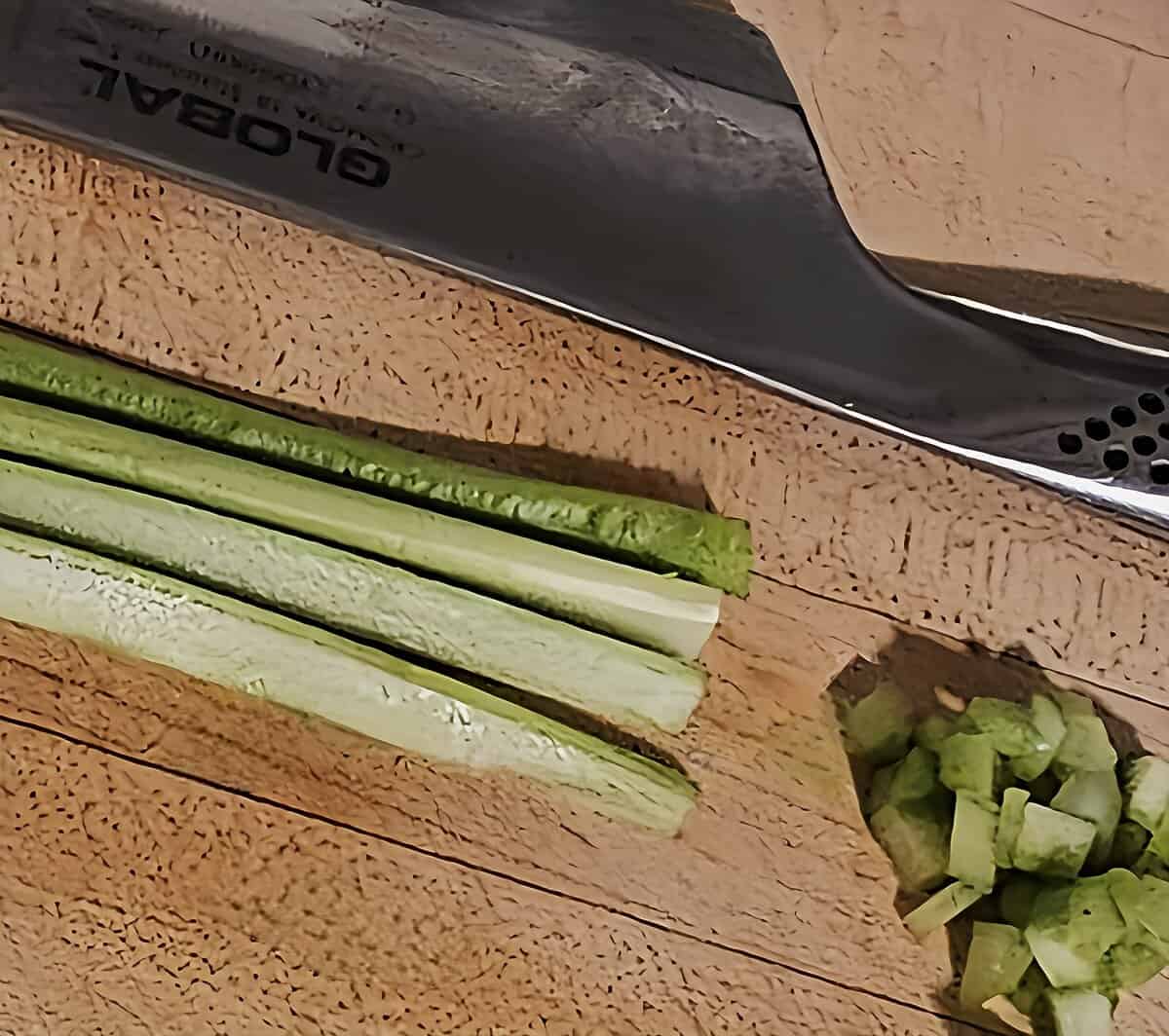 celery, sliced into thin strips, and then again into very small brunoise dice.