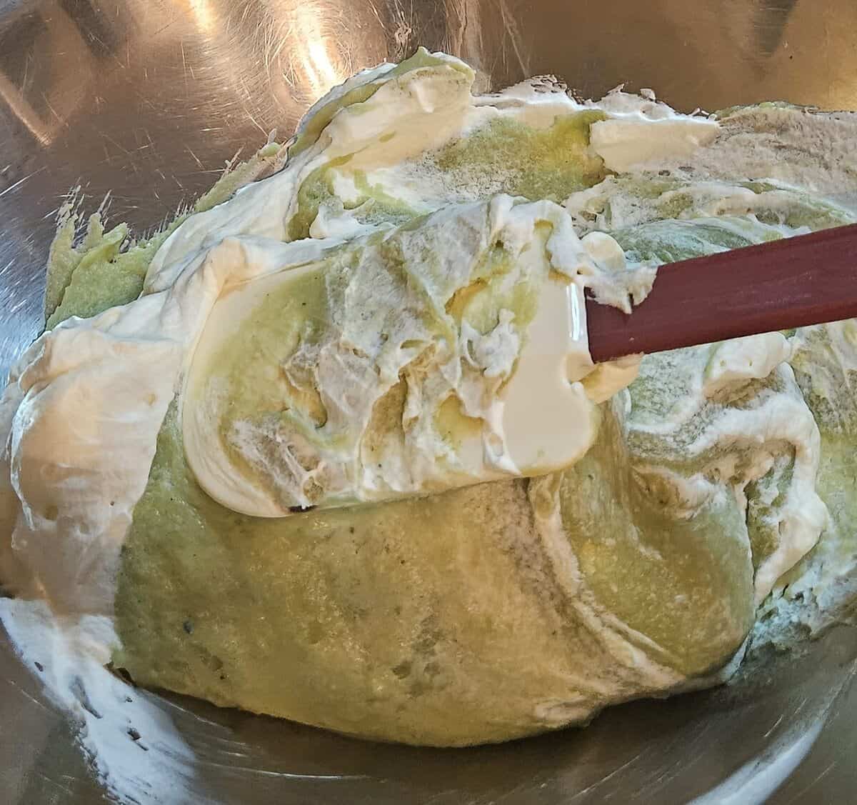 matcha pastry cream with whipped cream being folded in.