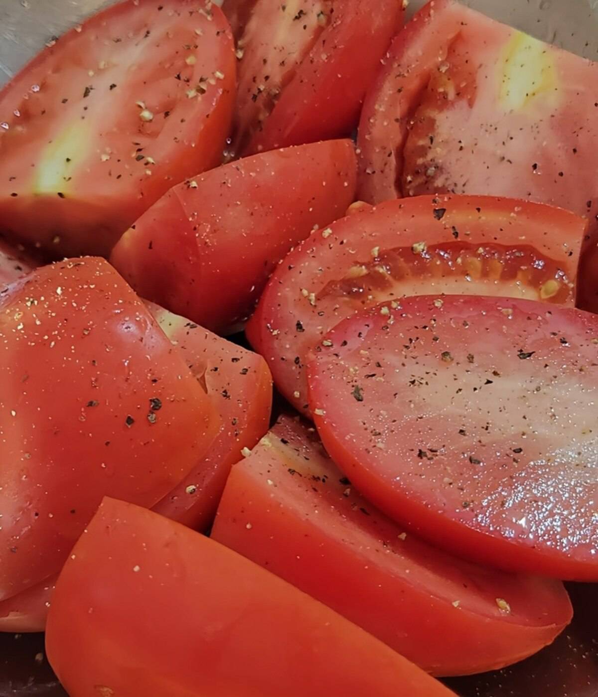 Tomatoes cut in half and seasoned