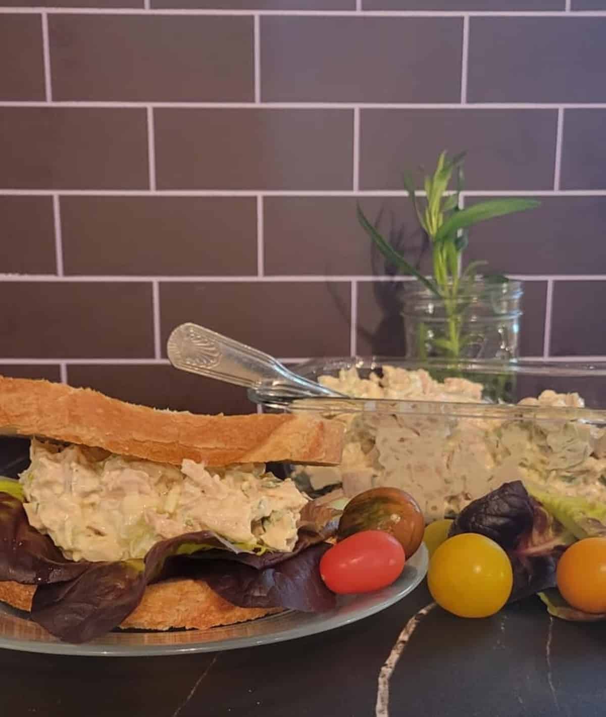 plated chicken salad sandwich, cherry tomatoes