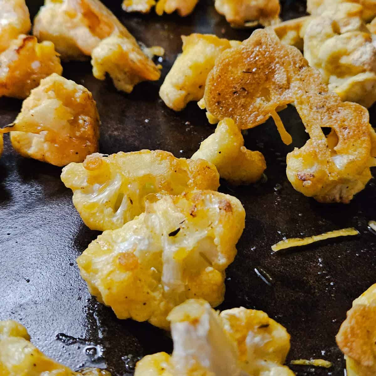 crispy cauliflower bites, finished on a pan coming out of the oven