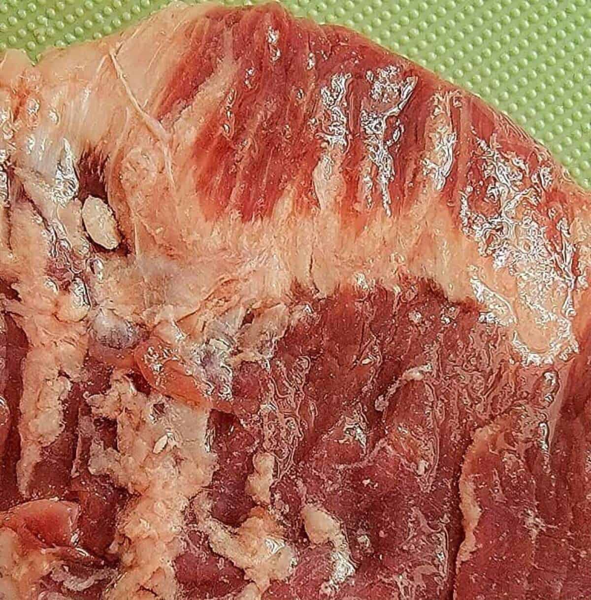close up of fatty edge of flank steak