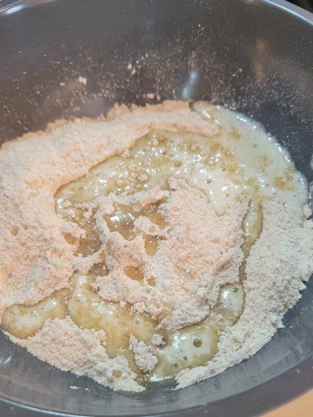 dry crumble ingredients in mixing bowl, melted butter on top