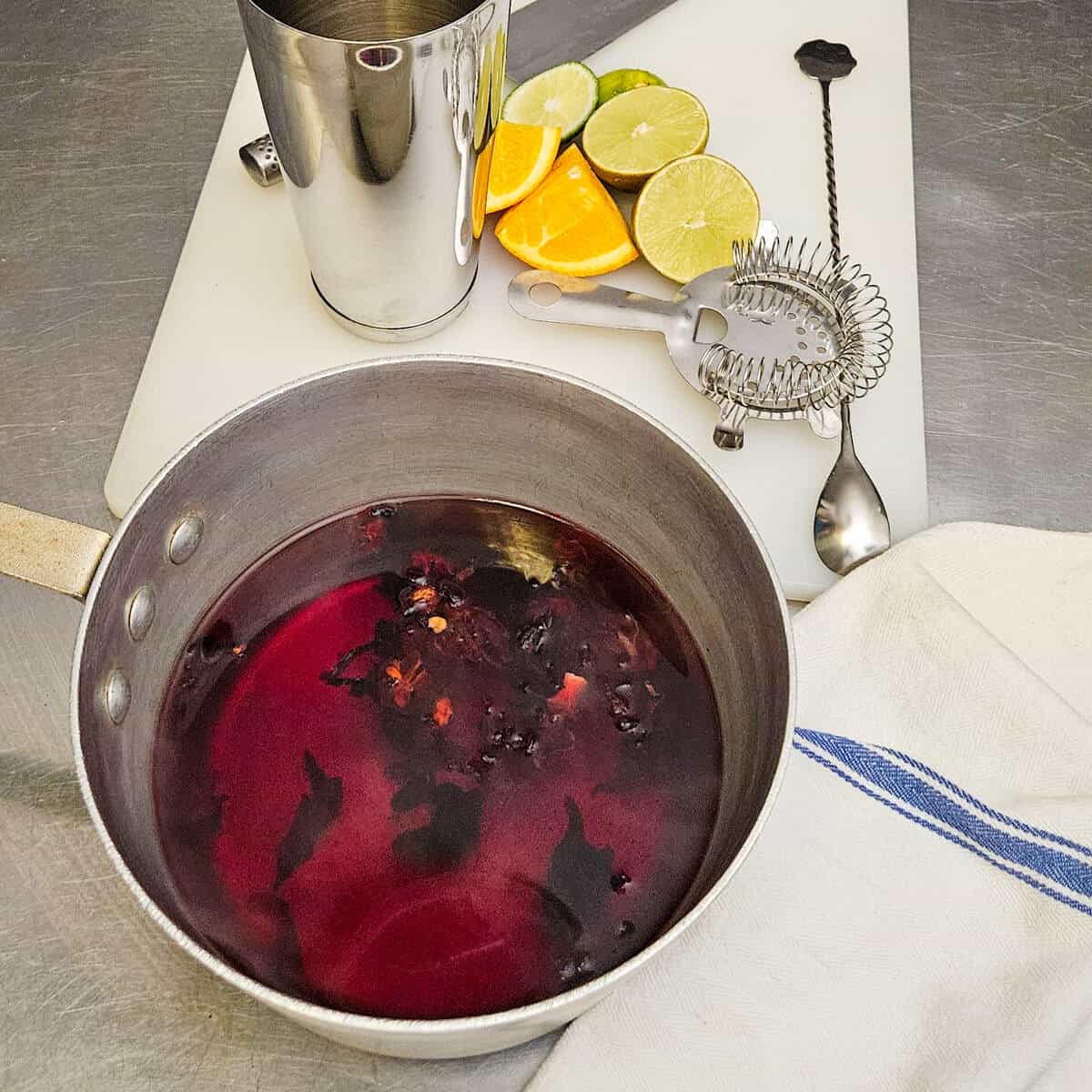 the dried hibiscus flowers steeping in hot water for the hibiscus margarita mocktail