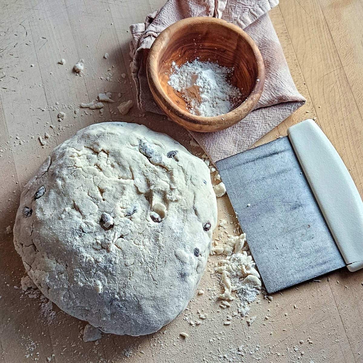 an image of the formed dough on the cutting board before cutting into two loaves of gluten free Irish soda bread