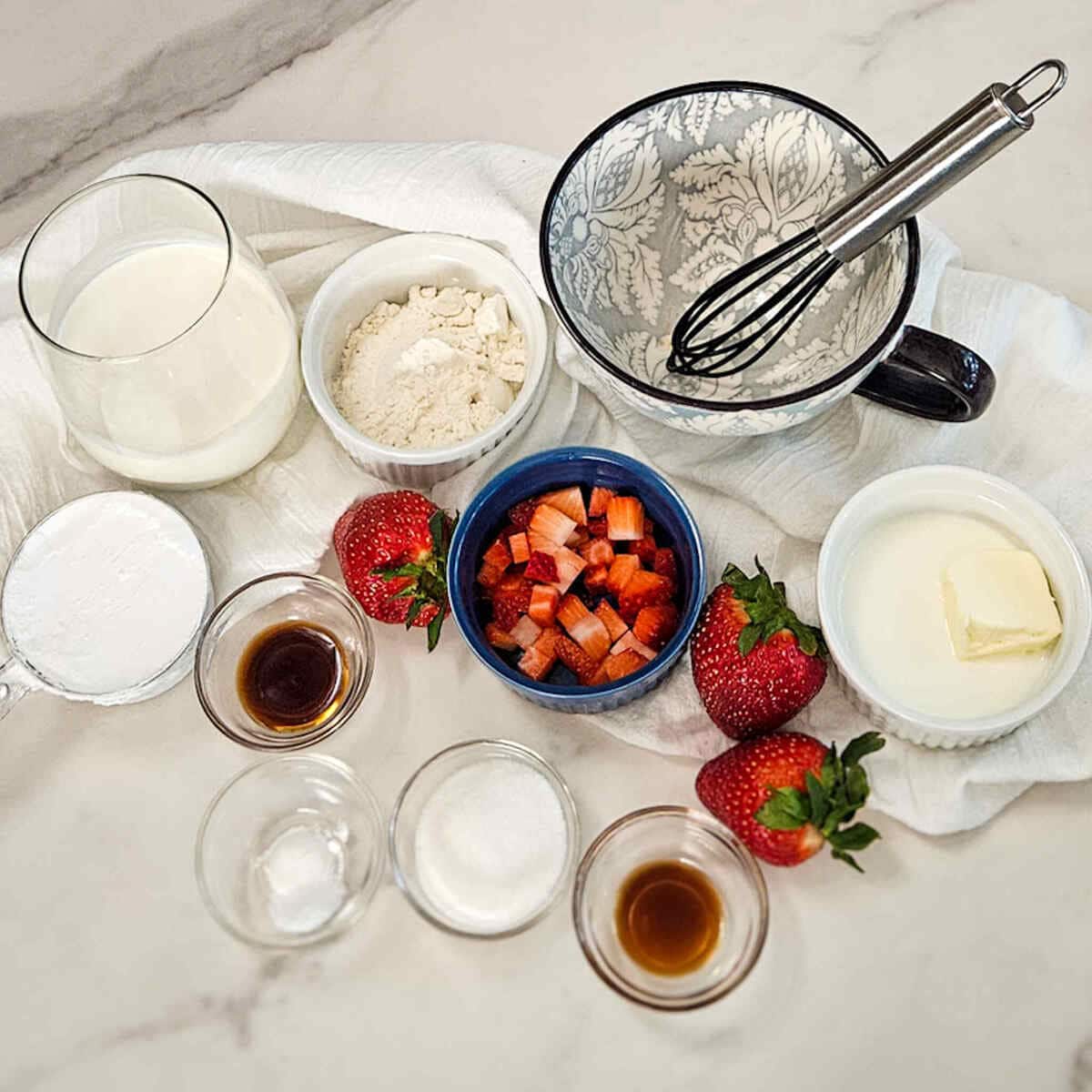 Ingredients for strawberry and cream mug cake.