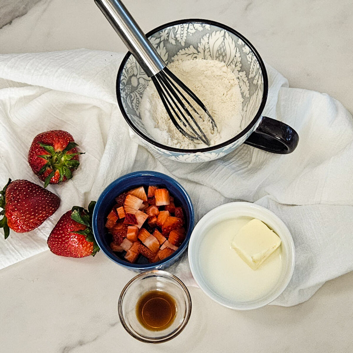 Ingredients for strawberry and cream mug cake.