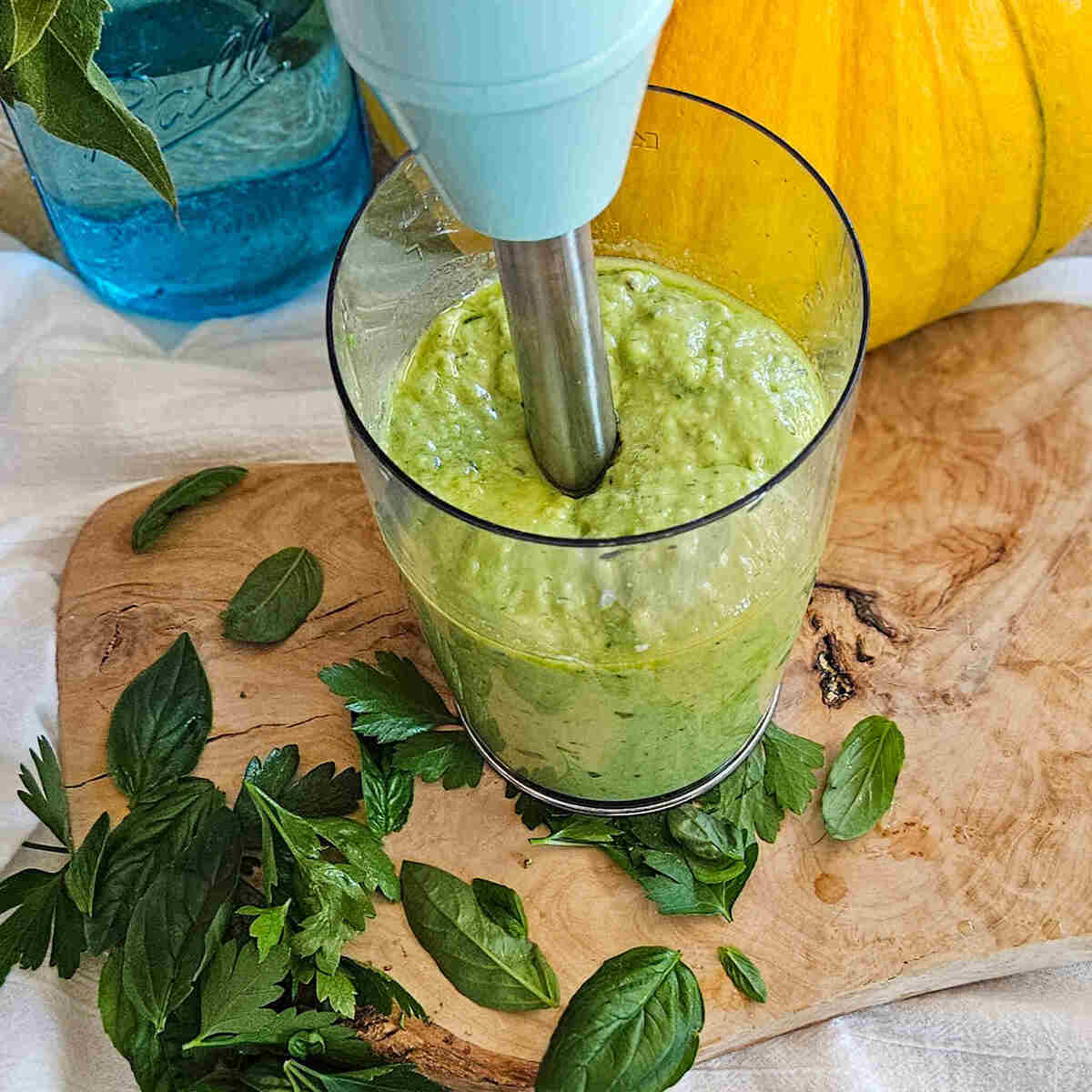 Blending the creamy avocado salad dressing.