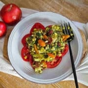 Fresh vegetable salad featuring tomatoes, corn, and pumpkin seeds, ideal for healthy eating.