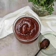 Kansas city BBQ sauce in a glass jar, perfect for recipes and meal prep.