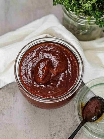 Kansas city BBQ sauce in a glass jar, perfect for recipes and meal prep.