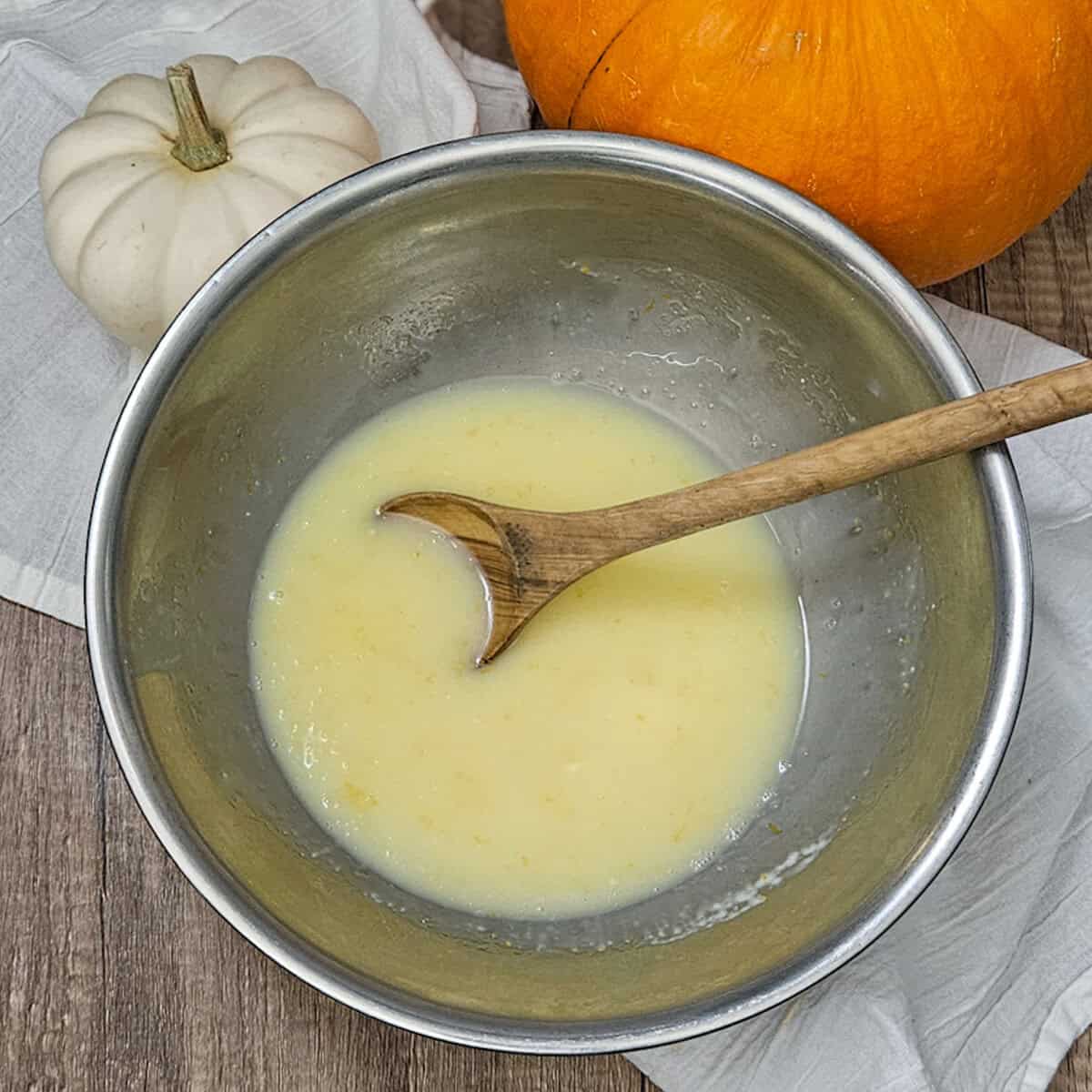 Mixing the white chocolate ganache for the pumpkin spice zucchini bread.