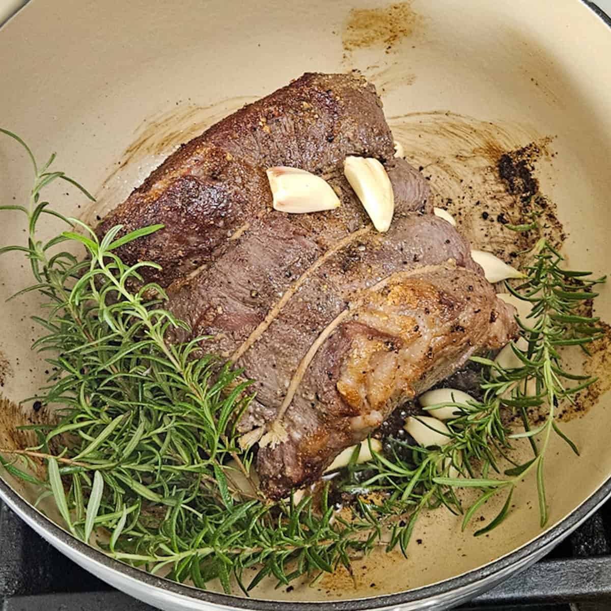 Juicy beef roast with garlic, rosemary, and spices for delicious flavor.