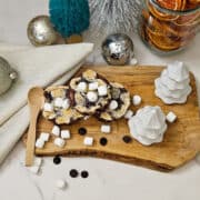 Delicious hot cocoa brownies topped with mini marshmallows, perfect for holiday treats and celebrations.