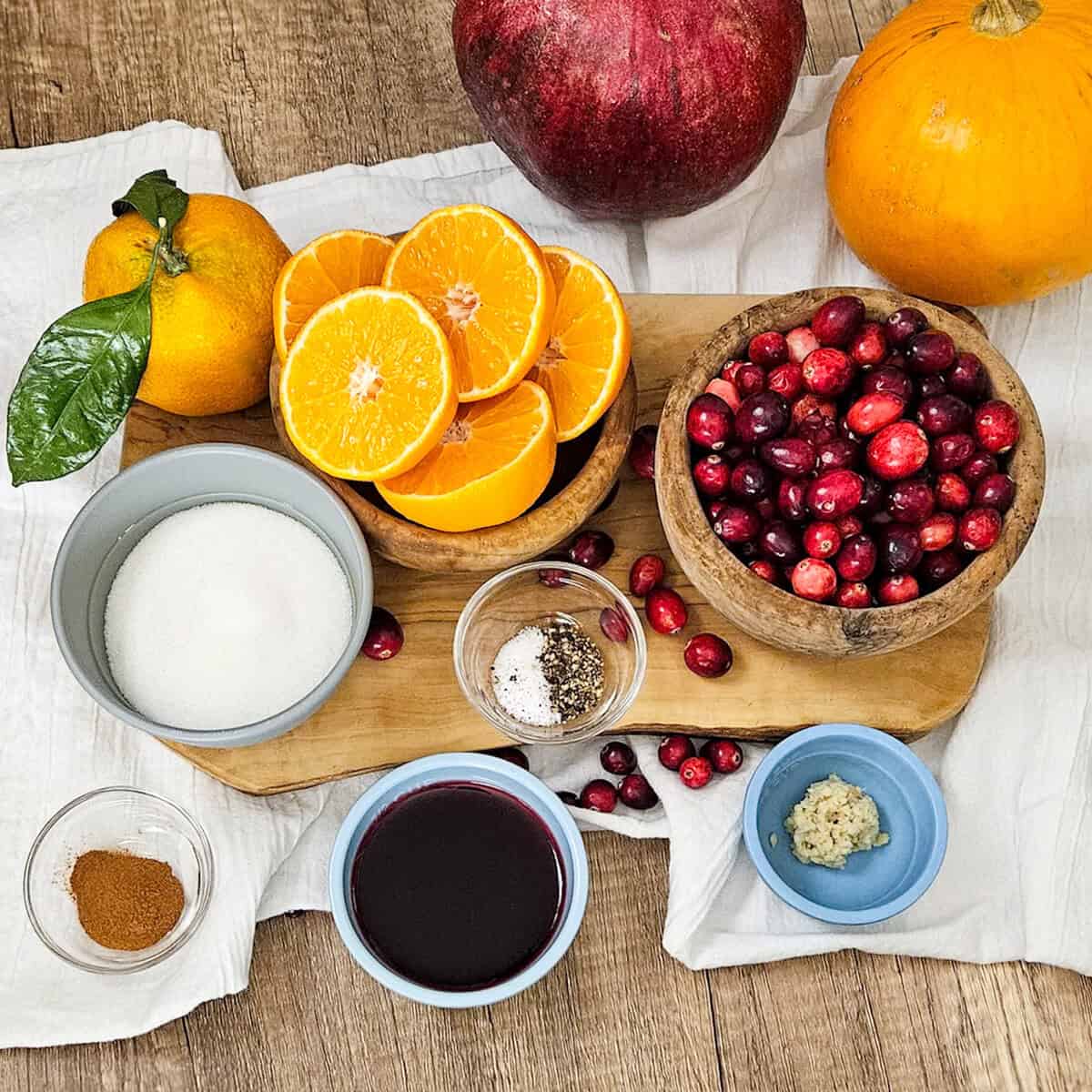Bright citrus slices, fresh cranberries, and ingredients for seasonal recipe preparation.
