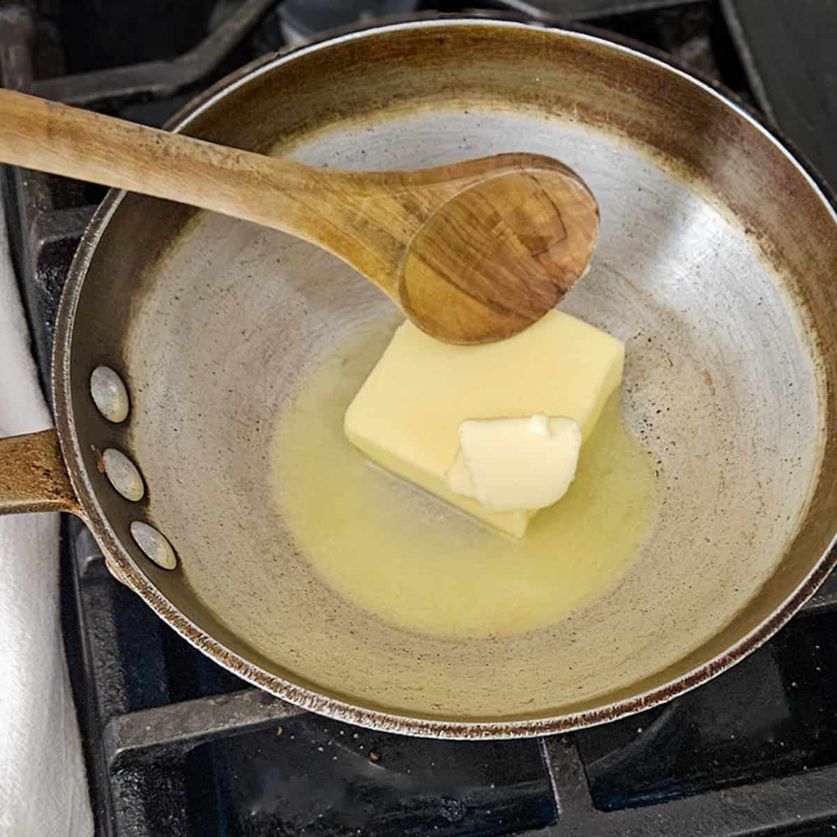 Buter melting in a skillet for cooking or baking.