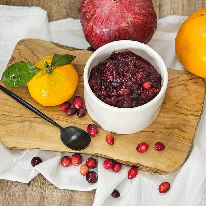 Rich homemade cranberry pomegranate sauce with fresh citrus and cranberries for delicious flavors.