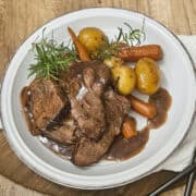 Tender beef with carrots, potatoes, and herbs served with rich gravy. Ideal for autumn-themed meals.