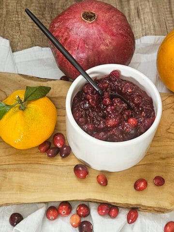Vibrant cranberry sauce featuring pomegranate,, and tangerine flavors, perfect for seasonal recipes.