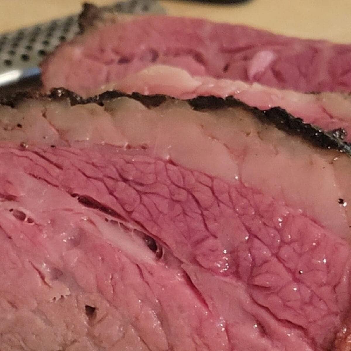 Closeup of sliced smoked tri tip roast.