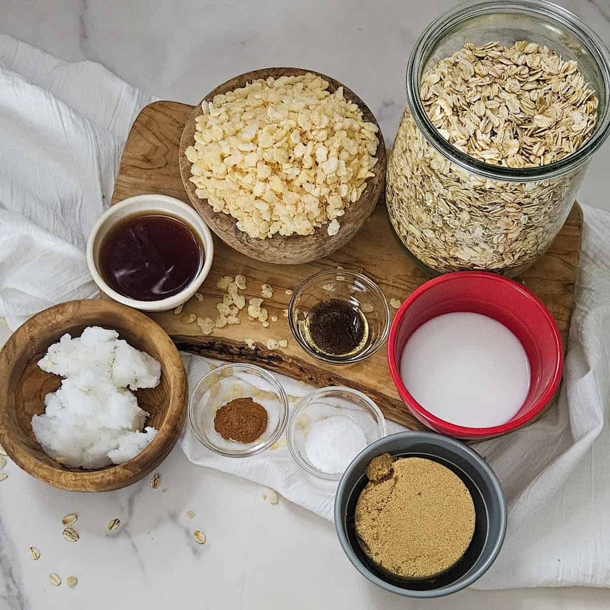 Chai spice granola ingredients including oats, milk, honey, coconut oil, and spices for breakfast.