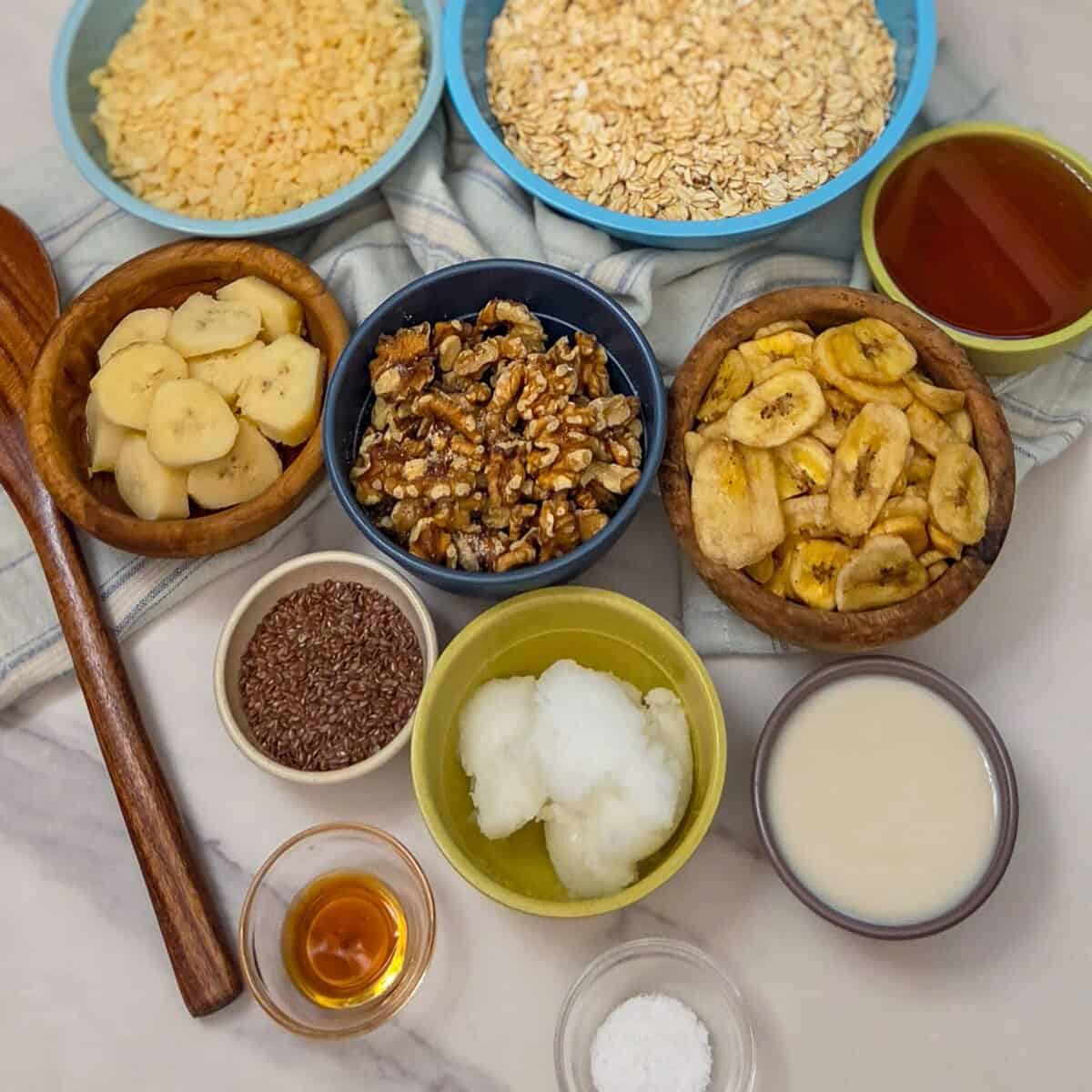 The ingredients for banana walnut granola measured out into bowls.